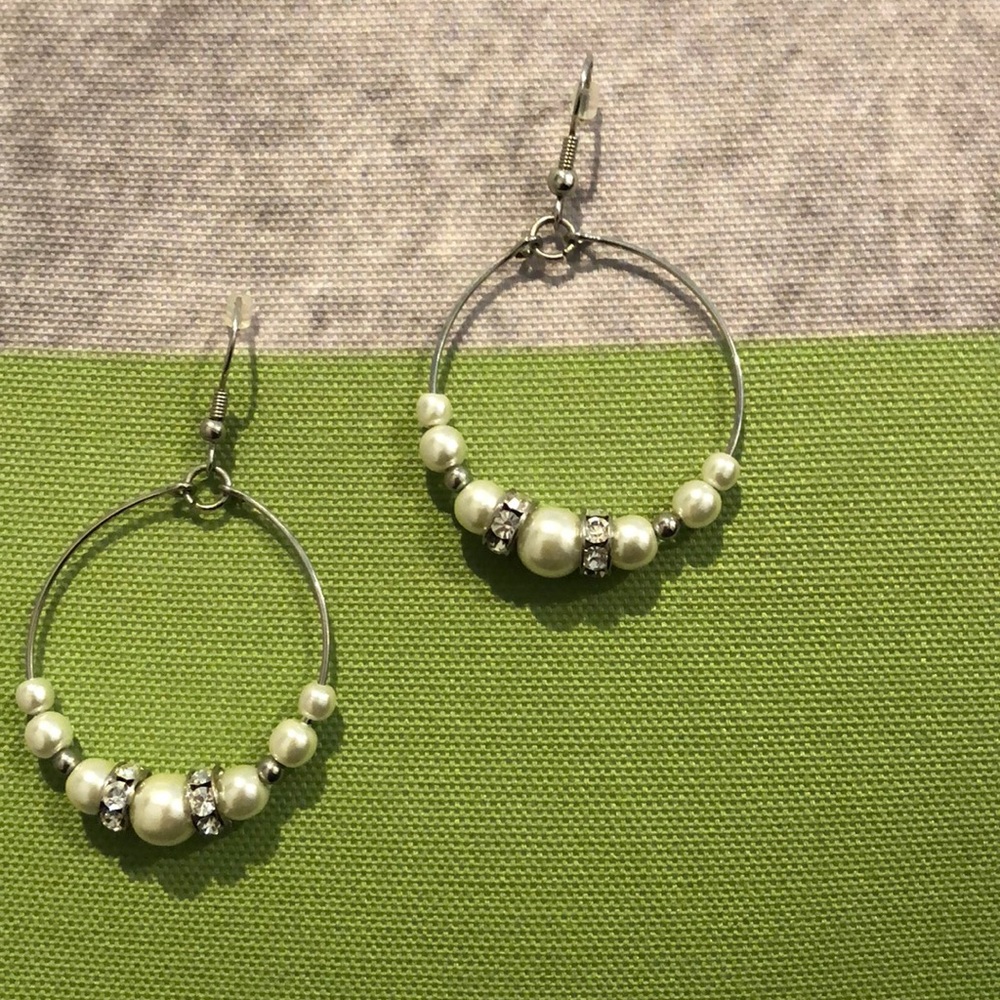 Silver hoops with pearls and rhinestones.